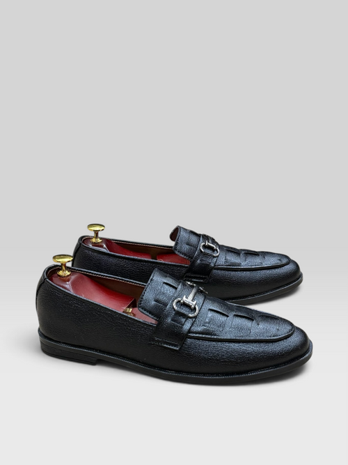 VELORO black textured loafers for men with silver horsebit detail and striking red interior lining.