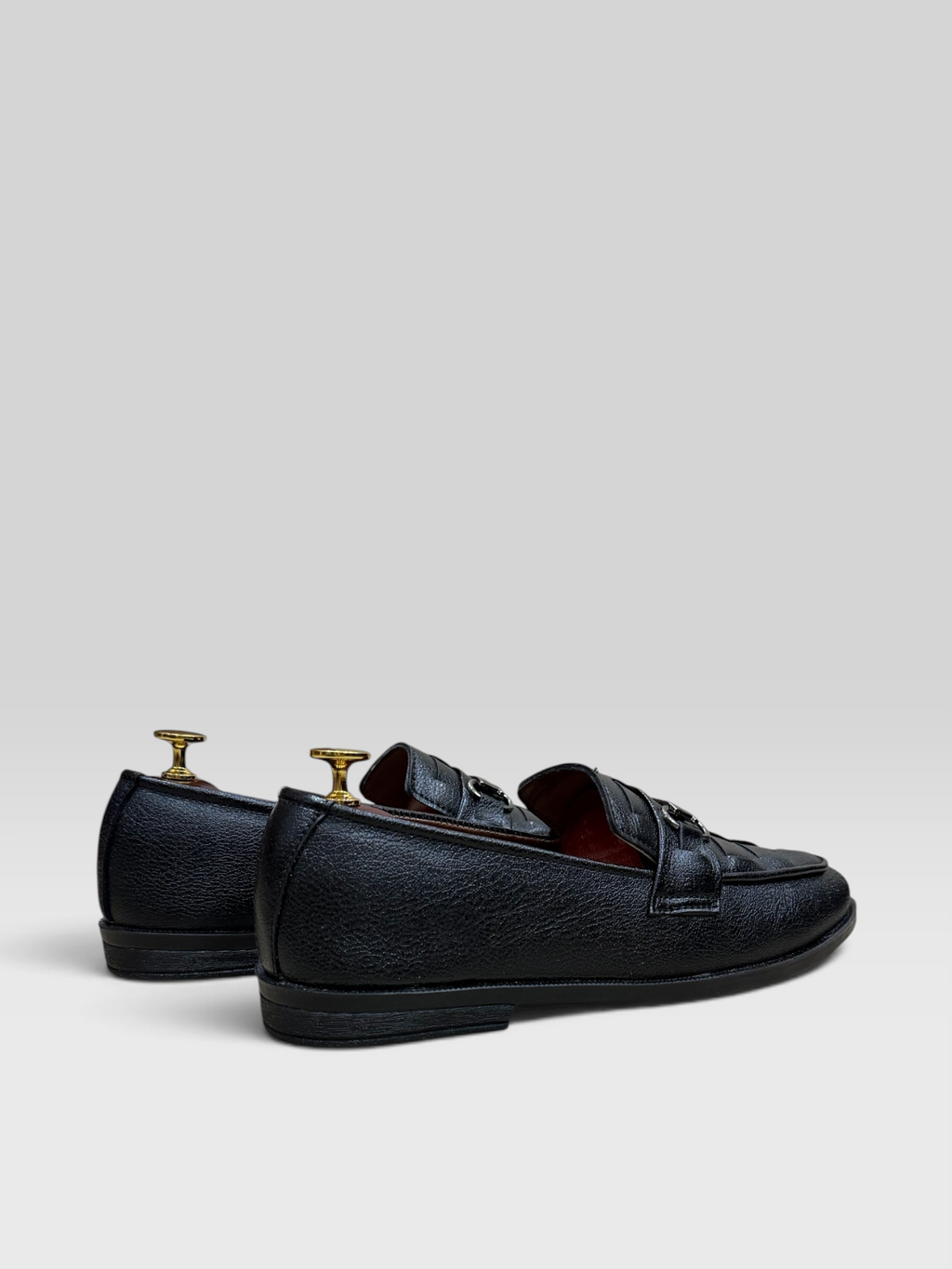 VELORO black textured leather loafers for men with silver horsebit detail and red interior lining