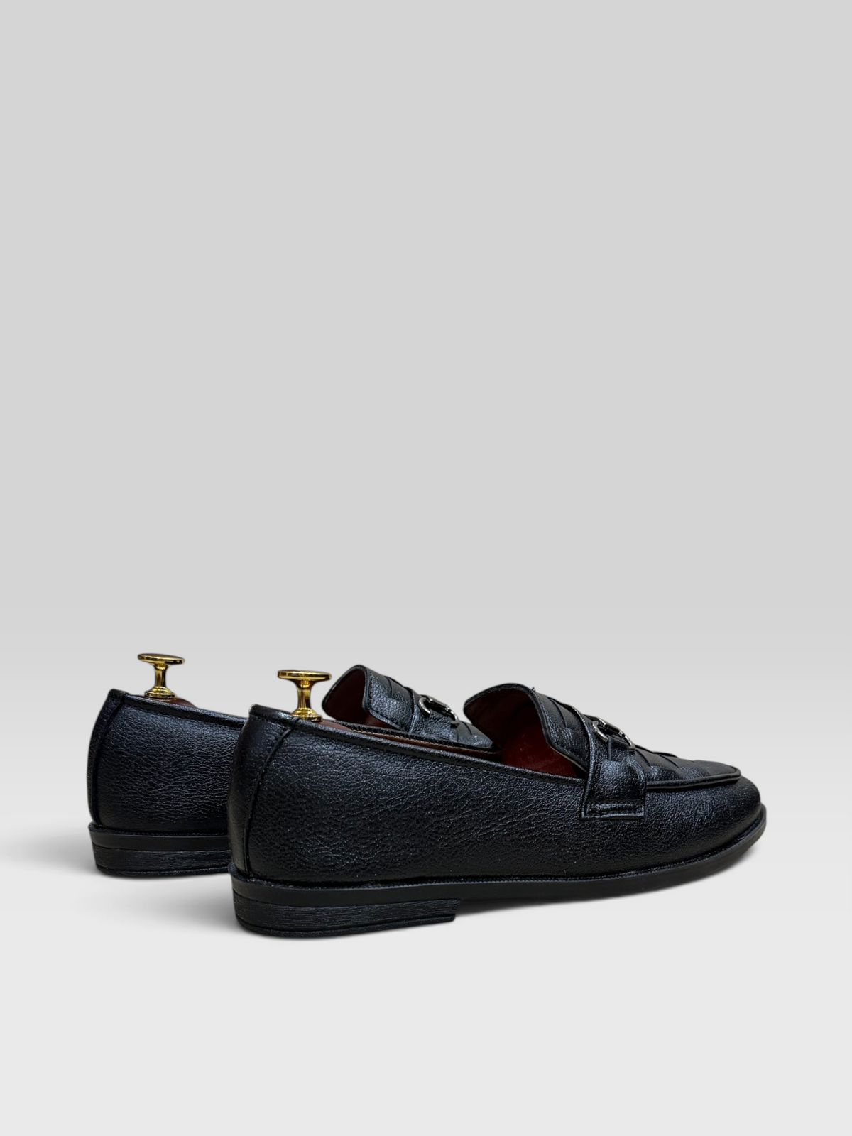 VELORO black textured leather loafers for men with silver horsebit detail and red interior lining