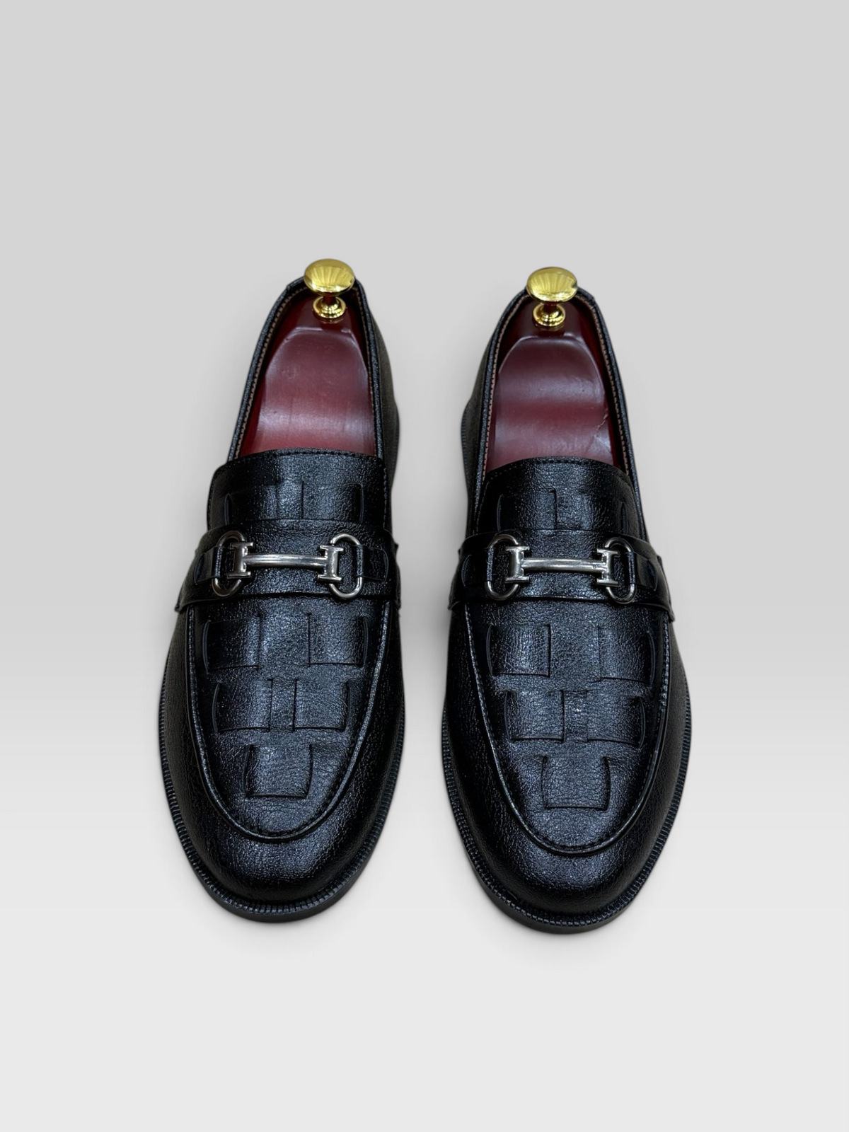 VELORO black men's loafers with a woven-look textured vamp, silver horsebit detail, and contrasting red interior lining.