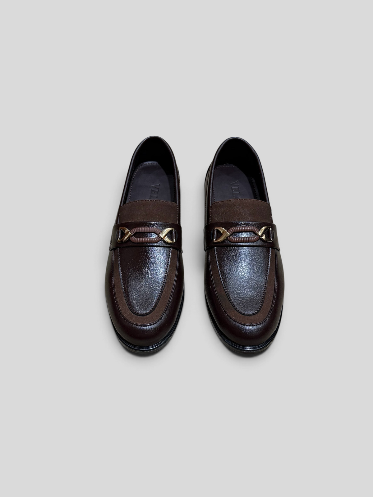 VELORO dark brown textured leather formal loafers with gold-toned metal hardware detail on the vamp